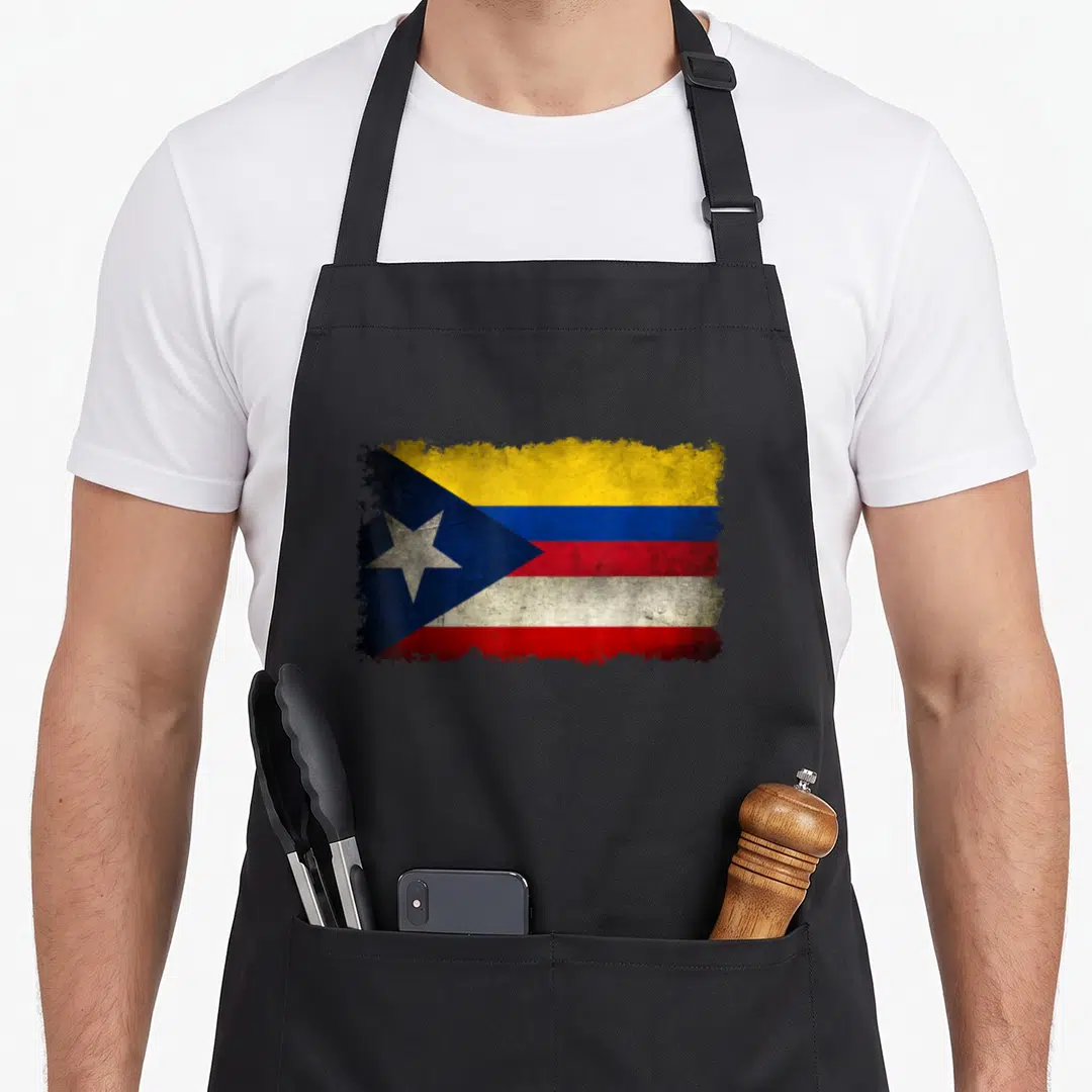 Puerto colombian apron - Distressed blended flag with blue yellow red white stripes and white star on blue triangle — shown on a black cotton canvas apron against a white background