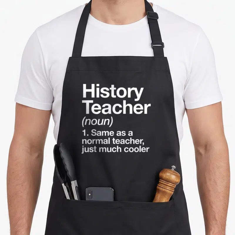 History art teacher apron - White stacked text reading History Teacher noun definition on grey background — shown on a black cotton canvas apron against a white background
