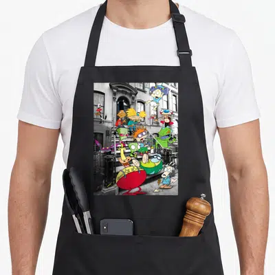 Nicktoon hanging apron - Invader Zim characters scattered on grey steps in red green blue and yellow — shown on a black cotton canvas apron against a white background