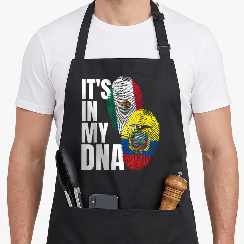 Ecuadorian mexican apron - Stacked white text IT'S IN MY DNA beside two fingerprints filled with Mexican and Ecuadorian — shown on a black cotton canvas apron against a white background