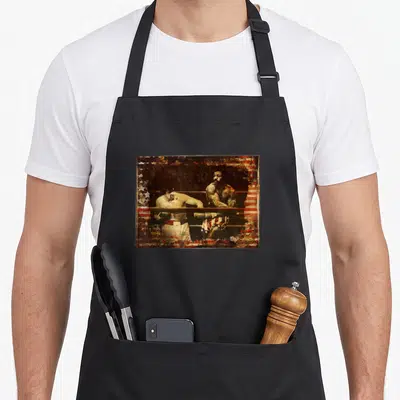 Upper apollo apron - Two boxers leaning on ring ropes with distressed flag pattern overlay in red white and blue — shown on a black cotton canvas apron against a white background