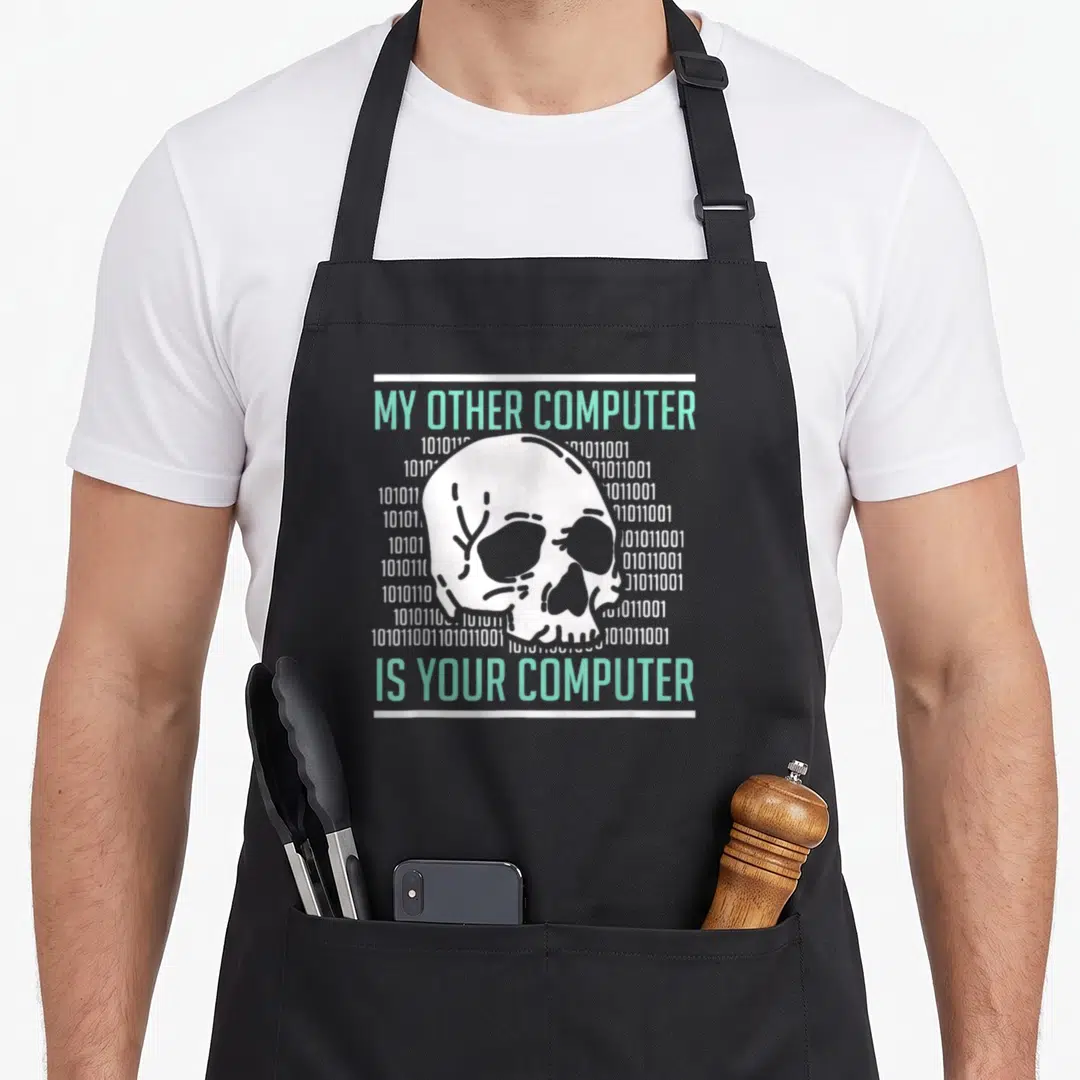Hacker cybersecurity apron - White skull between mint green text and binary code columns — shown on a black cotton canvas apron against a white background