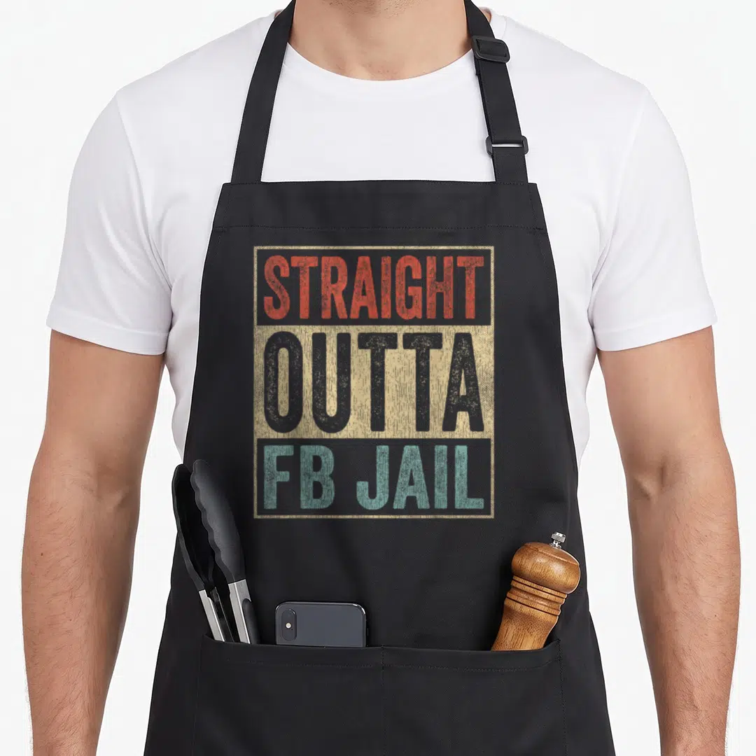 Straight lo addict apron - Distressed red grey and teal typography reading STRAIGHT OUTTA FB JAIL in a beige frame — shown on a black cotton canvas apron against a white background