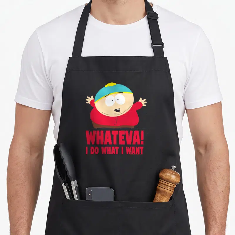 Cartman southern apron - Eric Cartman cartoon figure in red shirt and blue hat above red Whateva text — shown on a black cotton canvas apron against a white background