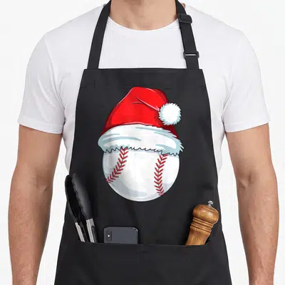 Xmas santa aprons - Cartoon white baseball wearing a red Santa hat with red stitching — shown on a black cotton canvas apron against a white background