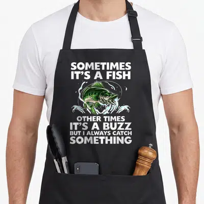 Rod fish fishing aprons - Green cartoon bass jumping with text sometimes its a fish other times its a buzz — shown on a black cotton canvas apron against a white background