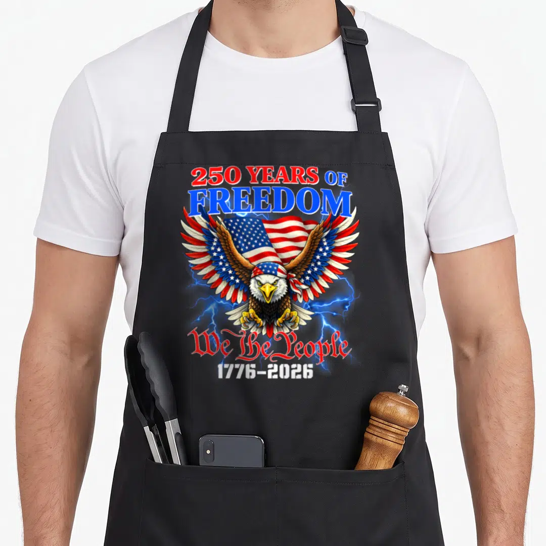 Vintage anniversary 4th of july apron - Bald eagle on flag with 250 YEARS OF FREEDOM and 1776-2026 text surrounded — shown on a black cotton canvas apron against a white background