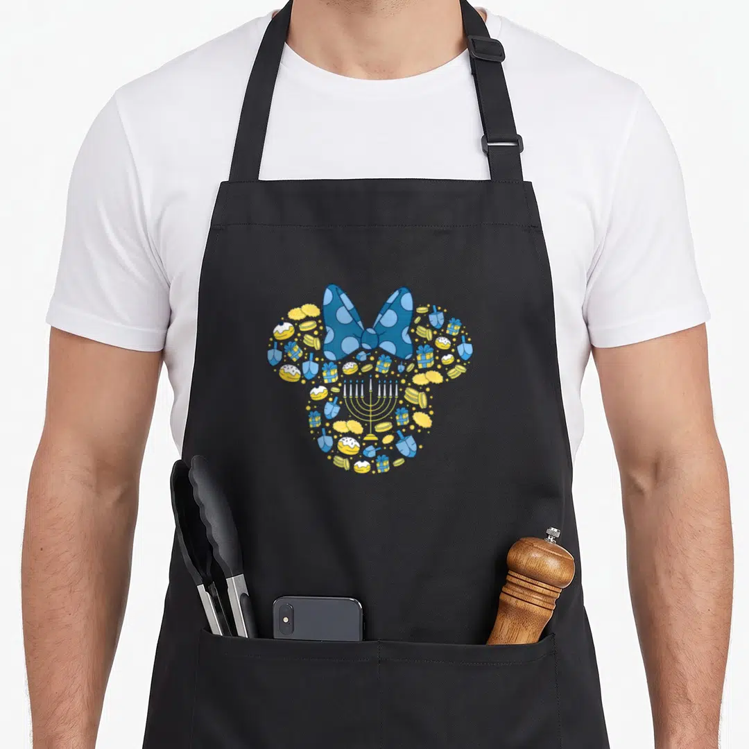 Icon hanukkah apron - Blue bow over menorah surrounded by dreidels, gifts, sufganiyot, and gelt in blue yellow white — shown on a black cotton canvas apron against a white background