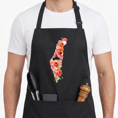 Floral palestine apron - Illinois silhouette filled with colorful roses and Illinois State Capitol building — shown on a black cotton canvas apron against a white background