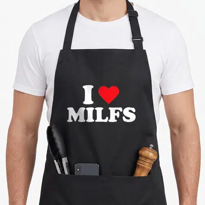 Milf i love my falcon apron - White I and MILFS text with a red heart graphic centered on front panel — shown on a black cotton canvas apron against a white background
