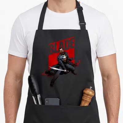 Blade hunter apron - Jumping character holding sword in front of red background with white BLADE text — shown on a black cotton canvas apron against a white background