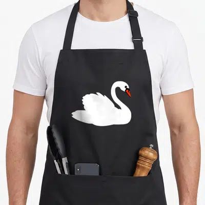 Vintage animal swan apron - Minimalist white swan with orange beak and black eye centered on grey background — shown on a black cotton canvas apron against a white background