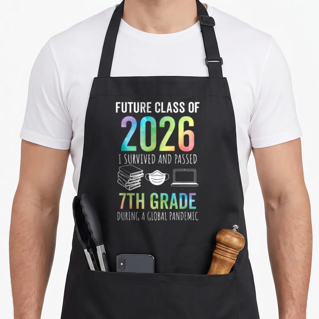 7th future class apron - FUTURE CLASS OF 2026 text with books mask laptop icons in white and rainbow gradient — shown on a black cotton canvas apron against a white background