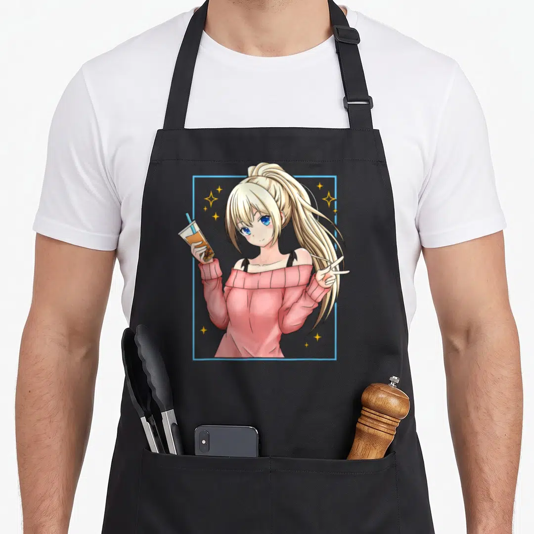 Bubble kawaii anime apron - Blonde anime girl in pink top holding drink and peace sign inside blue frame with yellow — shown on a black cotton canvas apron against a white background