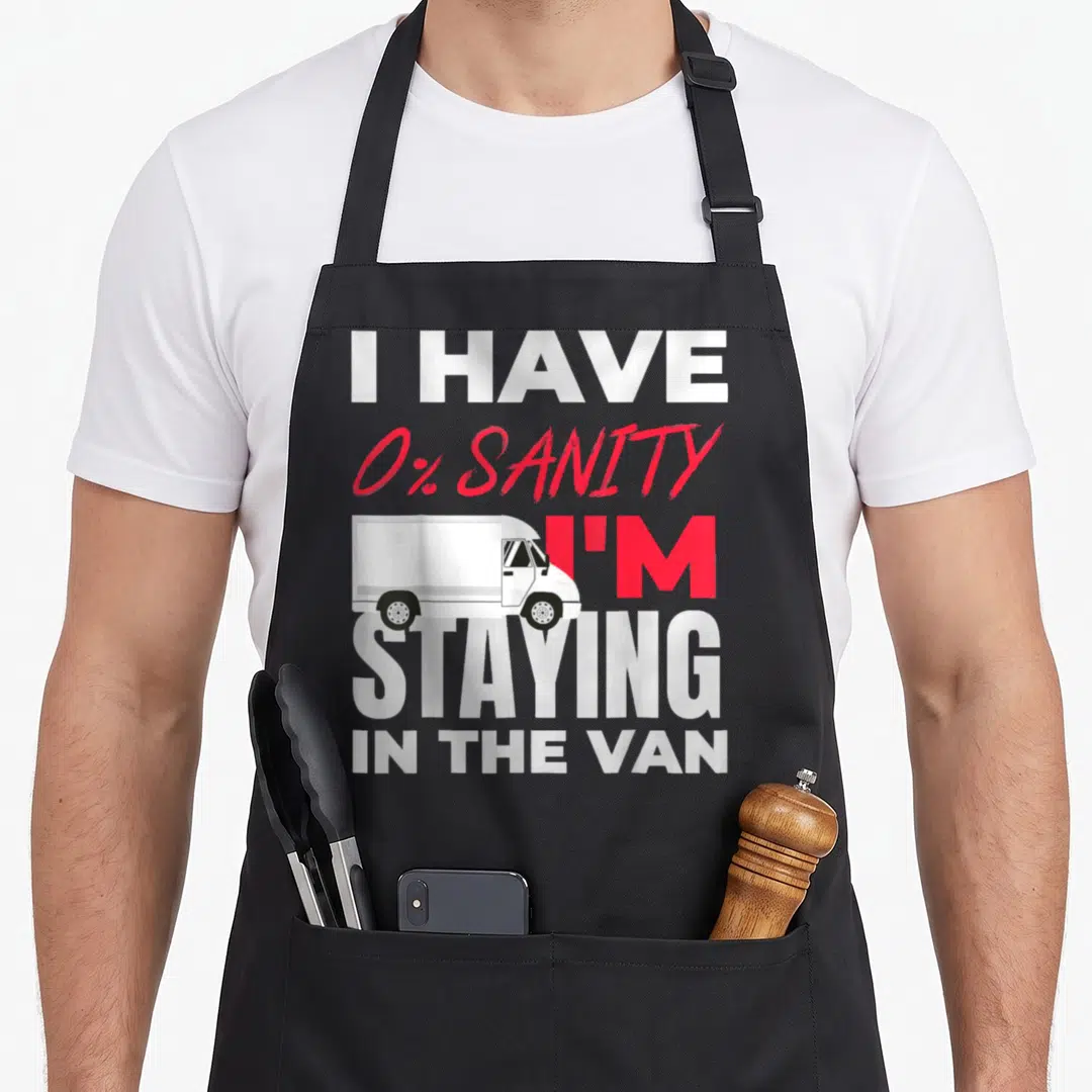 Staying van apron - White van graphic over red 0% sanity text stacked vertically — shown on a black cotton canvas apron against a white background