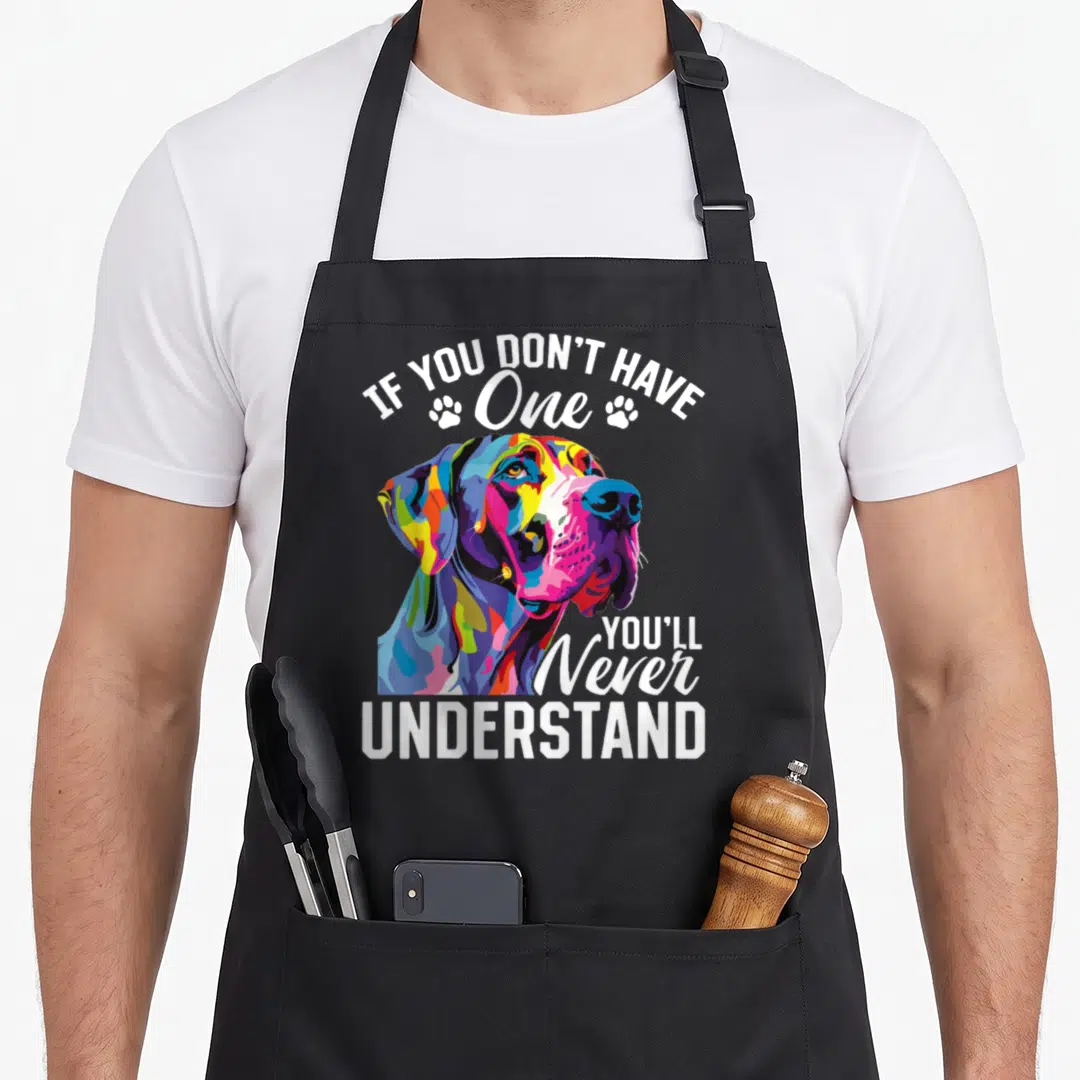 Dane dog breed aprons - Colorful cartoon Great Dane head with IF YOU DON'T HAVE One YOU'LL Never UNDERSTAND text — shown on a black cotton canvas apron against a white background