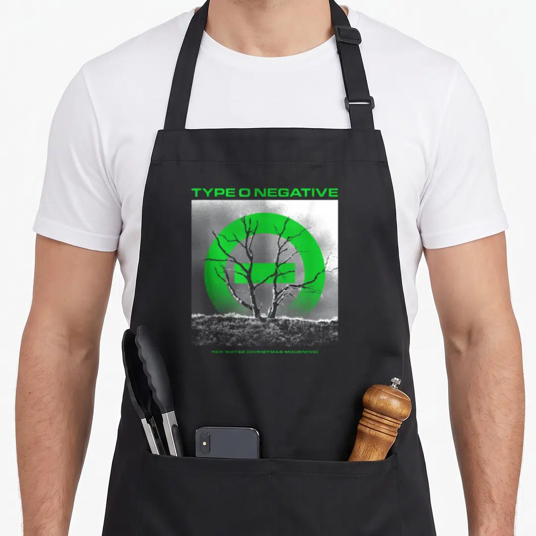 Negative water apron - TYPE O NEGATIVE text above green circle symbol and white leafless tree with RED WATER caption — shown on a black cotton canvas apron against a white background