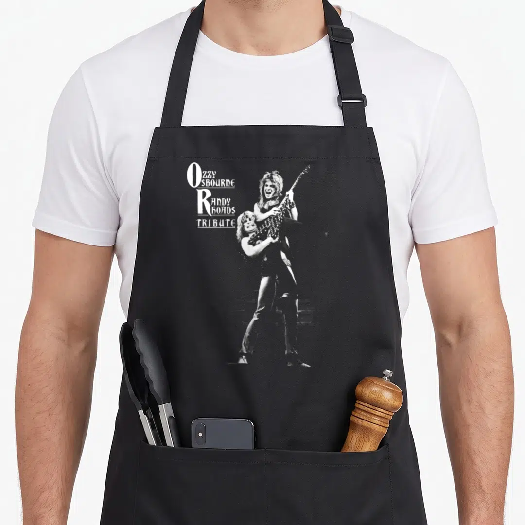 Tribute ozzy osbourne apron - Ozzy SBOURNE Randy BOADS TRIBUTE text with guitarist illustration in white and grey — shown on a black cotton canvas apron against a white background