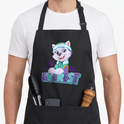 Everest novelty apron - Cartoon husky with purple paw prints and EVEREST text in teal and purple banner — shown on a black cotton canvas apron against a white background