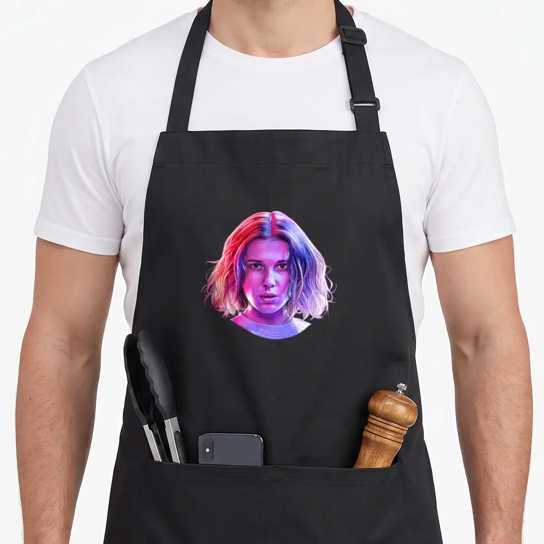 Eleven drip apron - Realistic portrait of a woman with a nose drip in purple, pink, and blue colors — shown on a black cotton canvas apron against a white background