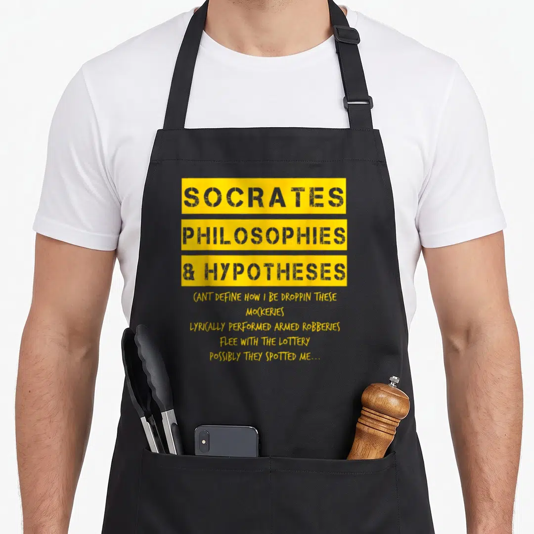 Golden hip apron - Yellow and grey typography reading Socrates Philosophies Hypotheses with rap lyrics below — shown on a black cotton canvas apron against a white background