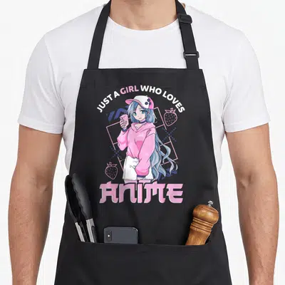 Anime apron for mom - Blue haired girl holding pink drink surrounded by strawberries and geometric grid — shown on a black cotton canvas apron against a white background