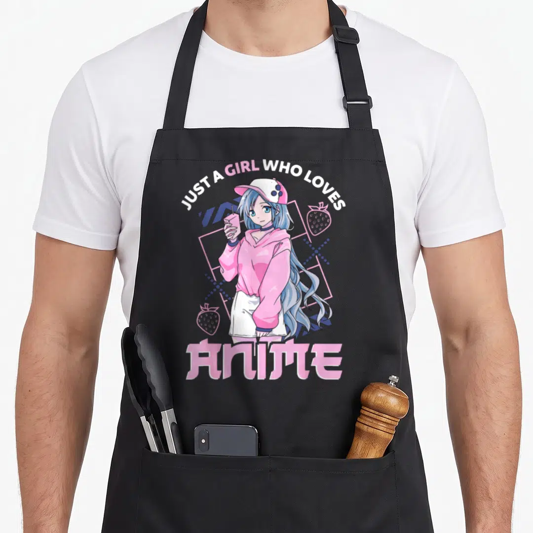 Anime apron for mom - Blue haired girl holding pink drink surrounded by strawberries and geometric grid — shown on a black cotton canvas apron against a white background