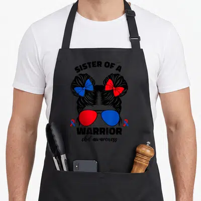 Warrior sister love apron - Sister of a Warrior text with red blue sunglasses and hair bows — shown on a black cotton canvas apron against a white background