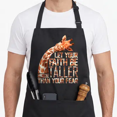 Faith giraffe apron - Watercolor giraffe neck curving around four lines of text filled with hide pattern — shown on a black cotton canvas apron against a white background