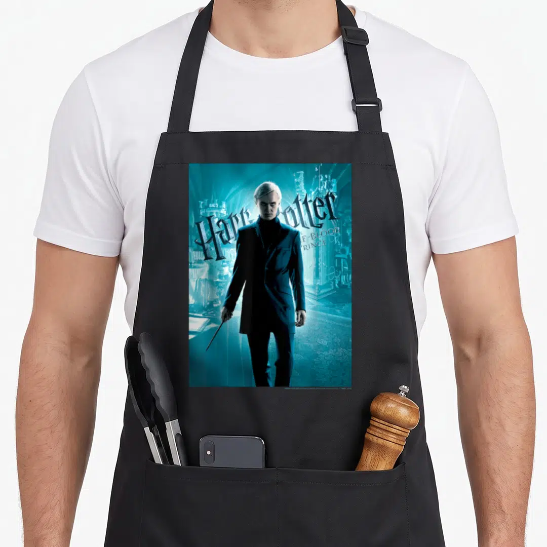 Prince blood apron - Man in suit holding wand with Harry Potter Half-Blood Prince text on blue background — shown on a black cotton canvas apron against a white background