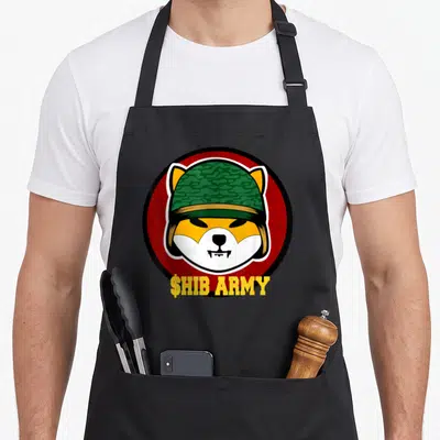 Shib investing apron - $HIB ARMY text under a shiba inu head wearing a green camo helmet inside a red circle — shown on a black cotton canvas apron against a white background