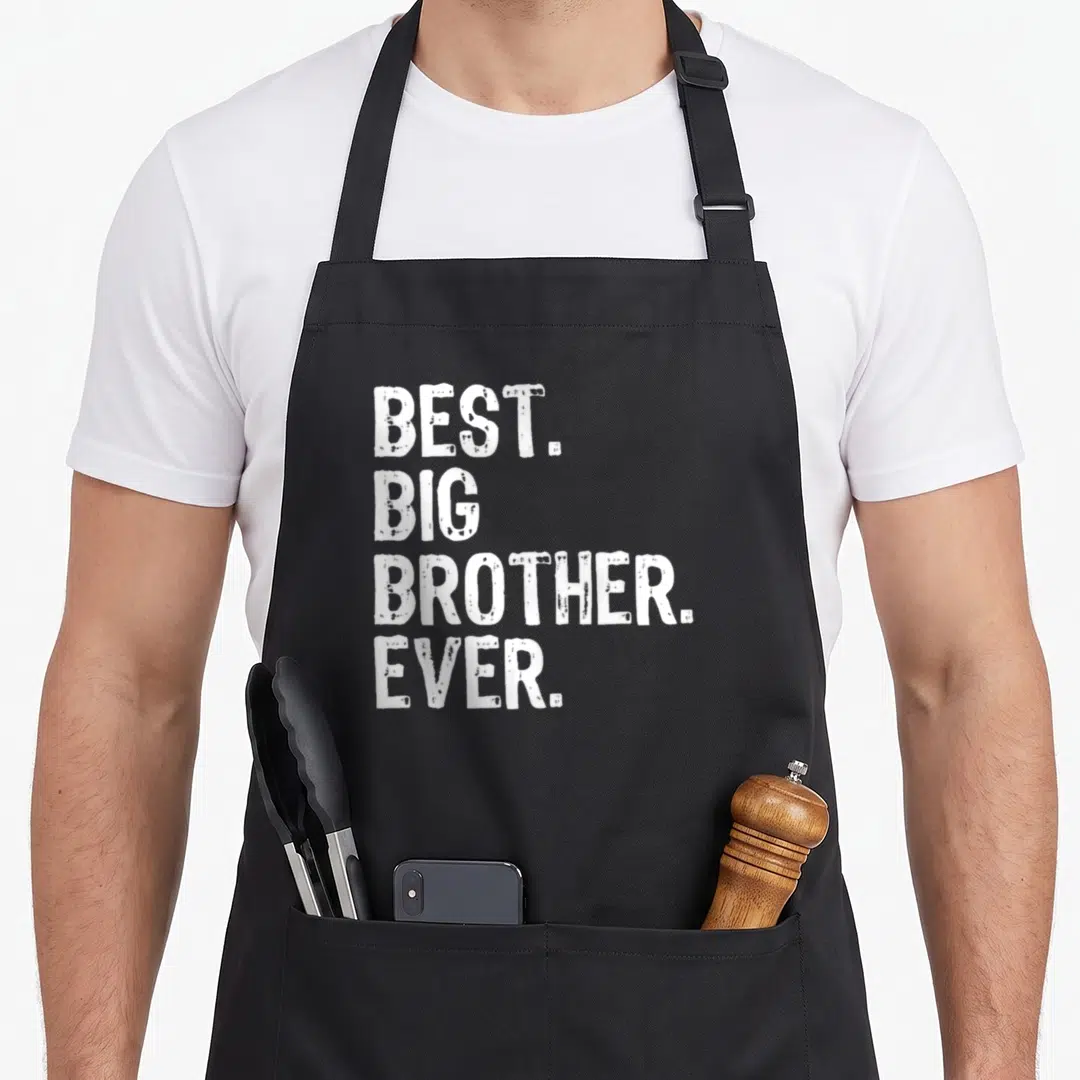 Cute best brother ever apron - White stacked text reading BEST. BIG BROTHER. EVER. in distressed font — shown on a black cotton canvas apron against a white background