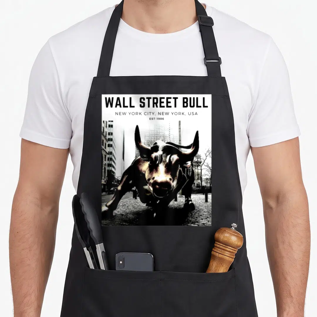 Trader stock show apron - Wall Street Bull statue photo with NYC text header — shown on a black cotton canvas apron against a white background