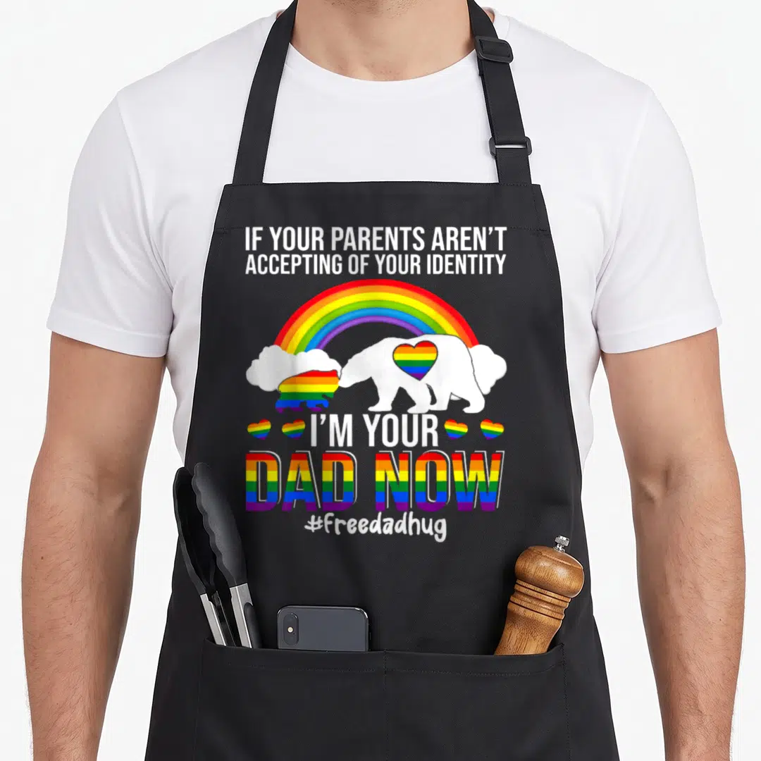 Lgbt bear apron - White bear with rainbow heart and text If Your Parents Aren't Accepting — shown on a black cotton canvas apron against a white background