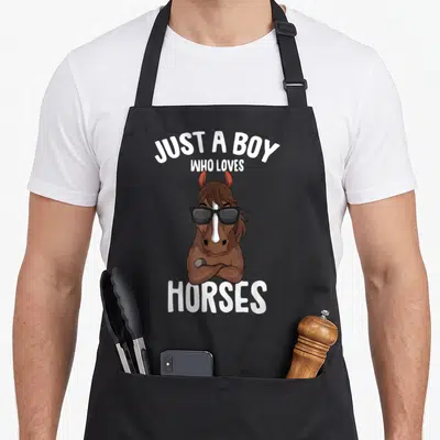 Equestrian horseback riding horse apron - Cartoon brown horse with black sunglasses and crossed arms under white text — shown on a black cotton canvas apron against a white background