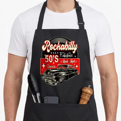 Swing 1950s apron - Black classic car under Rockabilly and 50's text on red background — shown on a black cotton canvas apron against a white background