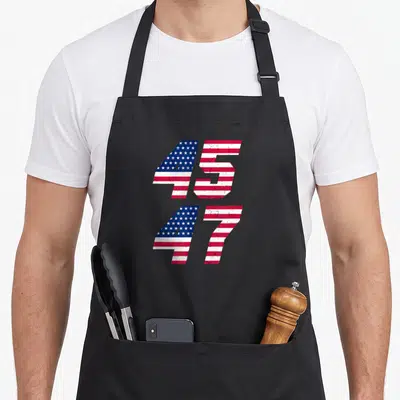 Comeback patriotic apron - Stacked numbers 45 and 47 filled with distressed red white and blue flag pattern — shown on a black cotton canvas apron against a white background