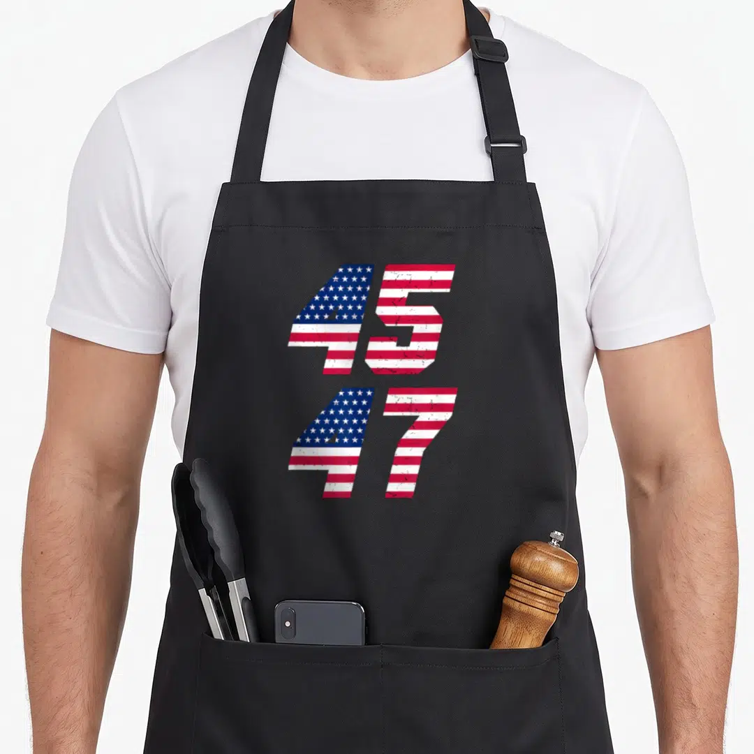 Comeback patriotic apron - Stacked numbers 45 and 47 filled with distressed red white and blue flag pattern — shown on a black cotton canvas apron against a white background
