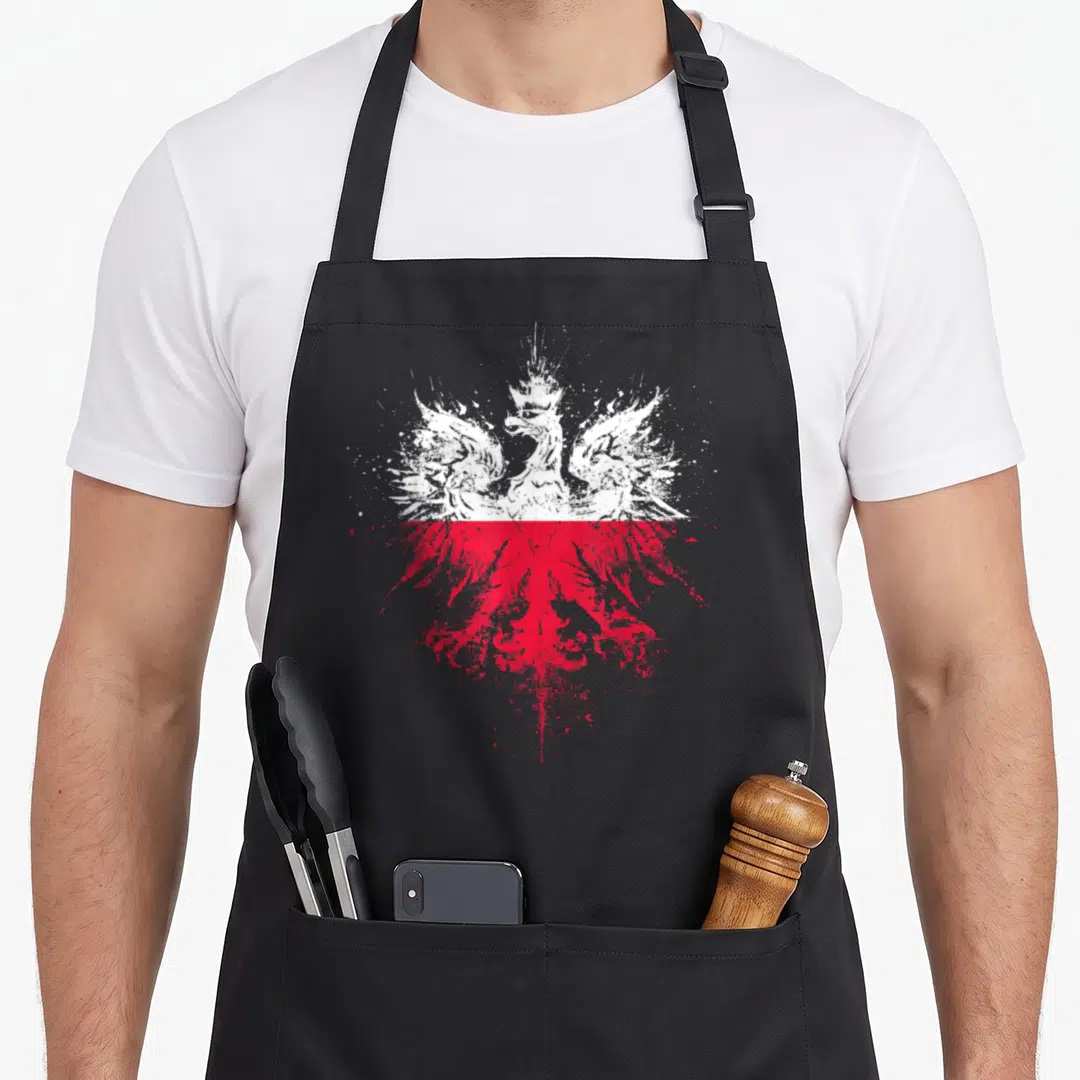 Eagle polish kitchen aprons - Distressed white and red split eagle graphic on gray background — shown on a black cotton canvas apron against a white background