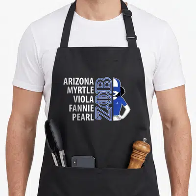 Phi paraphernalia sorority apron - Stacked white names ARIZONA PEARL beside blue ZΦB logo and partial woman illustration — shown on a black cotton canvas apron against a white background