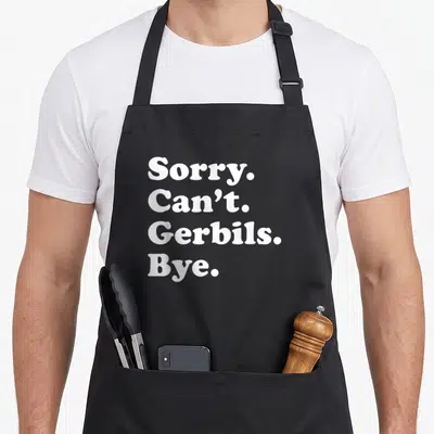 Gerbil apron or apron - White text reading Sorry Can't Gerbils Bye stacked vertically on dark background — shown on a black cotton canvas apron against a white background