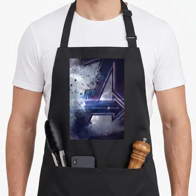 Endgame movie poster apron - Stylized A logo with debris and ENDGAME APRIL 26 text in purple blue silver — shown on a black cotton canvas apron against a white background