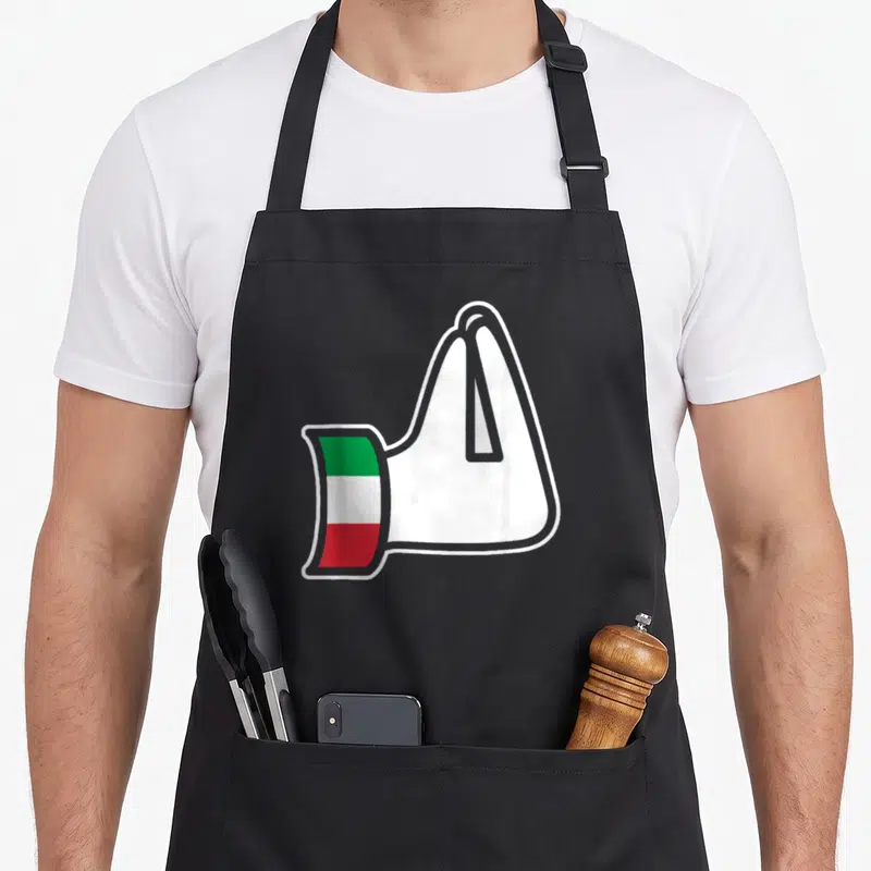 Hand italy apron - Cartoon white towel draped with green white and red Italian flag strip on the side — shown on a black cotton canvas apron against a white background