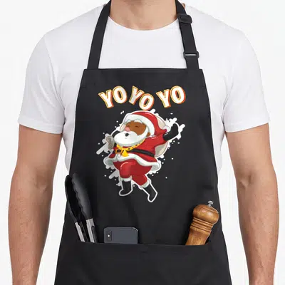 African christmas santa claus apron - Cartoon Santa with gold chain and arched YO YO YO YO text in red and orange — shown on a black cotton canvas apron against a white background