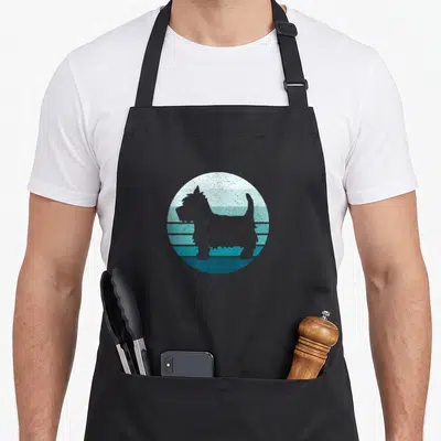 Terrier dog westie apron - Grey dog silhouette inside a circle of blue and white horizontal stripes with retro texture — shown on a black cotton canvas apron against a white background