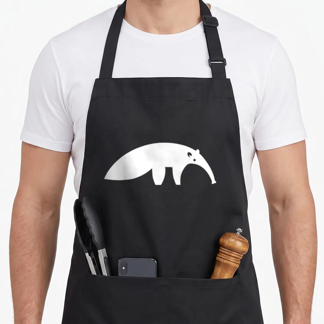 Funny anteater apron - White minimalist anteater silhouette centered on grey background — shown on a black cotton canvas apron against a white background