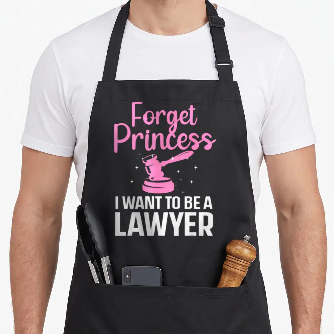 Graduate lawyer apron - Pink gavel with white sparkles and text Forget Princess I WANT TO BE A LAWYER — shown on a black cotton canvas apron against a white background