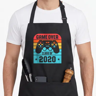 Student game aprons - Retro controller GAME OVER Class of 2020 striped design — shown on a black cotton canvas apron against a white background