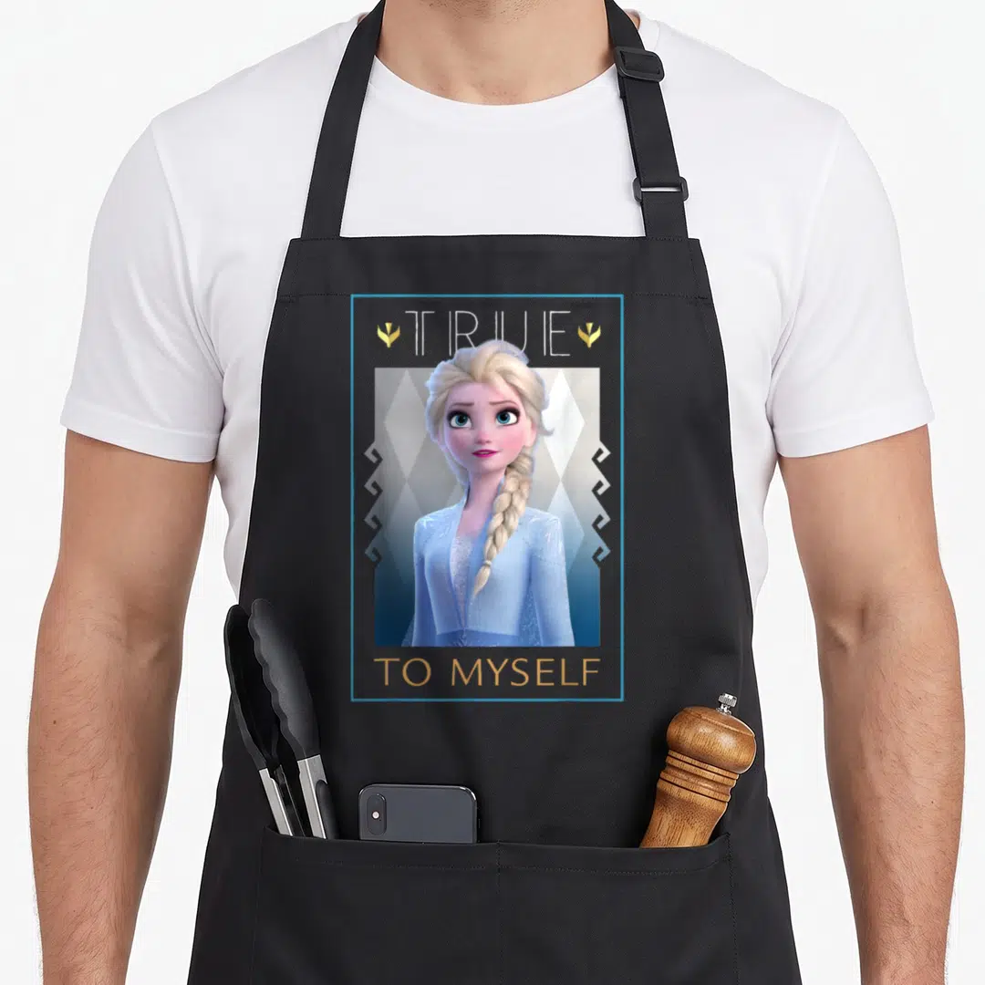 Myself frozen apron - Elsa portrait with TRUE TO MYSELF text and gold accents in blue white and gold — shown on a black cotton canvas apron against a white background