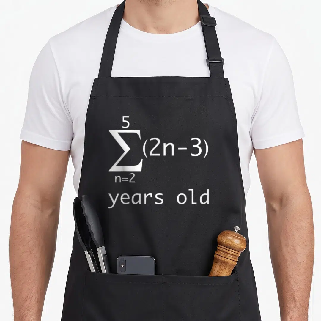 16th geek apron - White summation formula sigma n=2 5 (2n-3) years old text — shown on a black cotton canvas apron against a white background